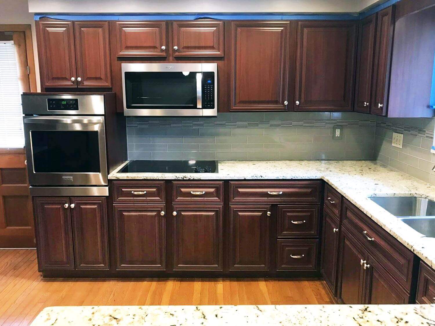 Brown Kitchen Cabinets with White Counter Top